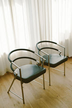 Modernist Chrome and Black Upholstered Armchairs