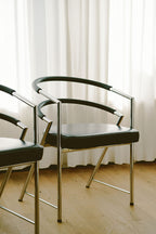 Modernist Chrome and Black Upholstered Armchairs