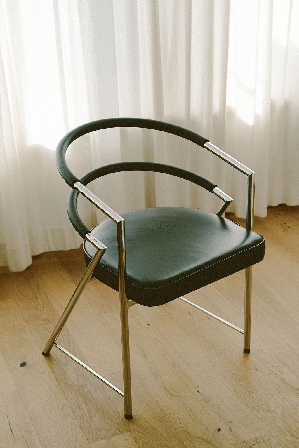 Modernist Chrome and Black Upholstered Armchairs